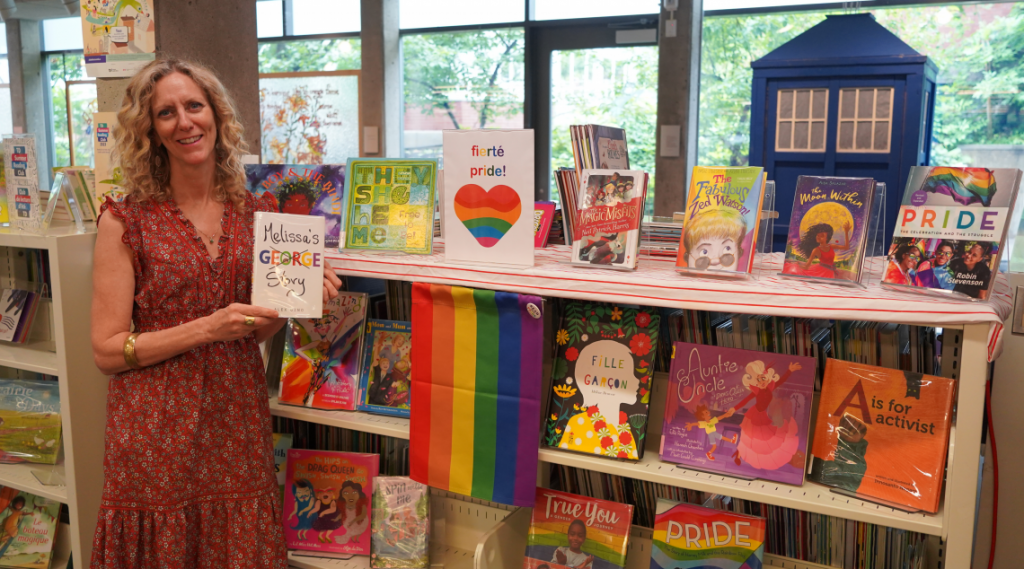 Librarian Wendy Wayling with the Pride book display at Westmount Library
